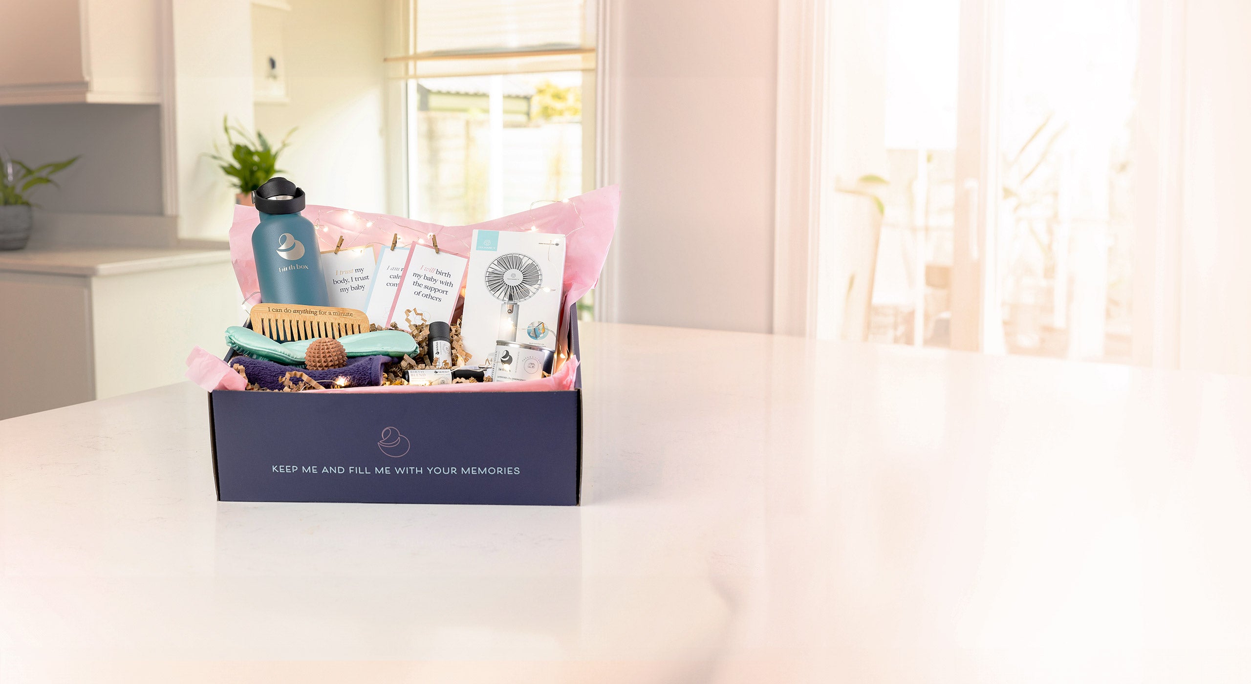The Birth Box open on a kitchen counter displaying all of the products inside